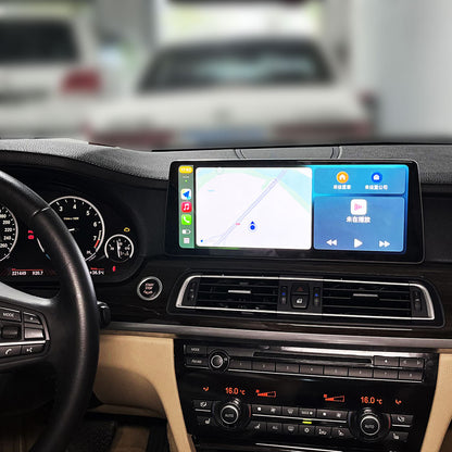 Wireless Apple CarPlay map navigation and music interface on BMW 7 Series dashboard screen